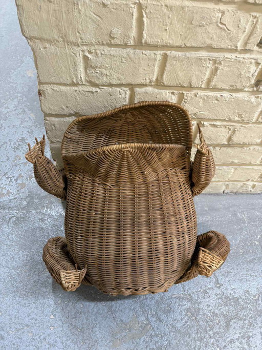 Vintage rattan newspaper rack with frog motif