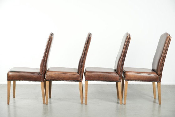 Image 1 of 4 x Vintage eetkamerstoel gemaakt van schapenleer met een hoge rug