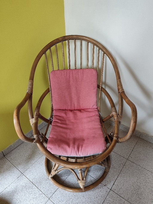Vintage swivel rattan armchair