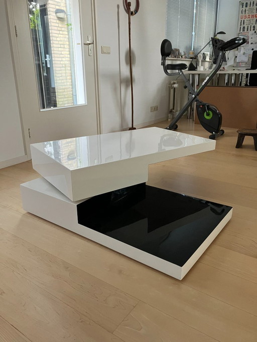 Table basse pivotante blanche/noire brillante