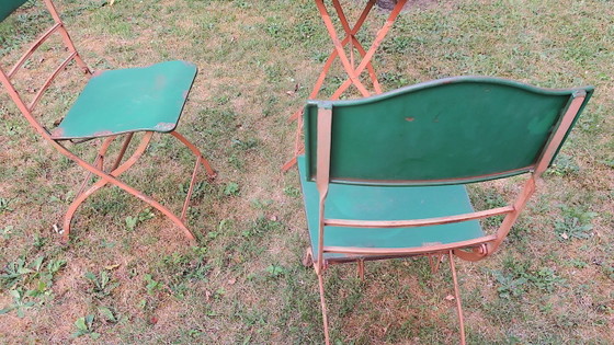 Image 1 of Table de jardin et 2 chaises en fer peint vieilli, style années 1960
