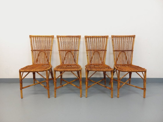 Image 1 of Suite de 4 chaises vintage Audoux Minet en rotin des années 50 60