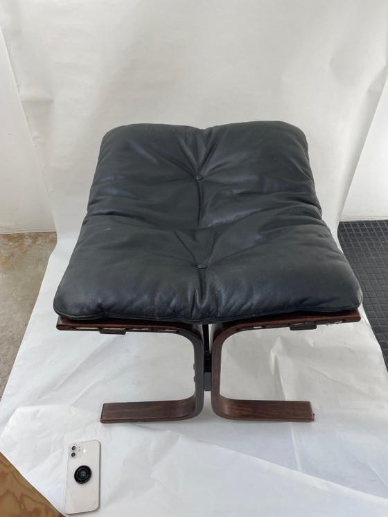 Image 1 of Siesta armchair and footrest in black leather and mahogany wood