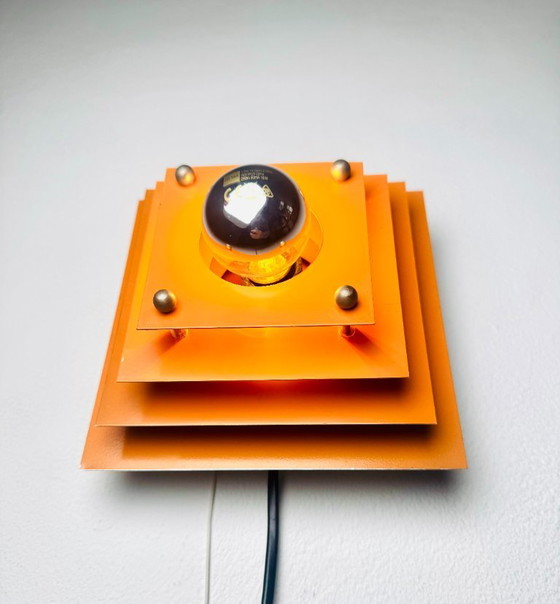 Pyramid layered wall lamp in orange by Hustadt Leuchten, Germany, 1960s – Wall lights, Metal (photo 2 of 6)