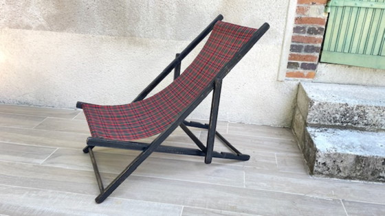 Image 1 of Vintage opklapbare tuinstoel van hout en canvas