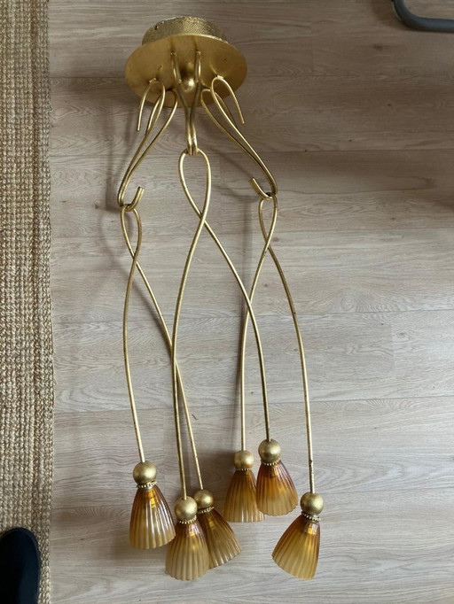 Vintage pendant lights with amber glass chalices and gold metal frame