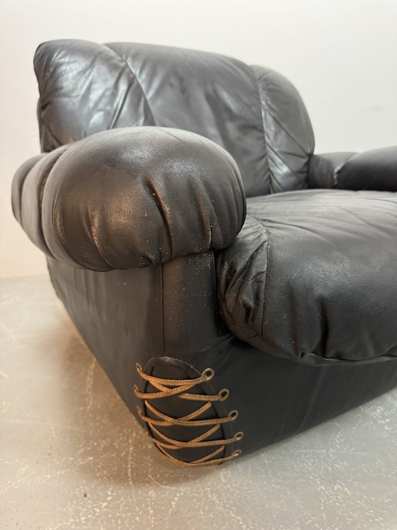 Image 1 of Beautiful Big Black Leather Postmodern Italian Design Space Age Lounge Chair with Brass Buttons and Playful Cord Lacing, 1970s.