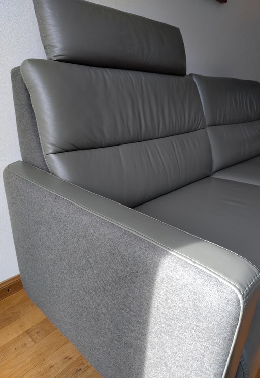 Prominent olive green two-seater sofa