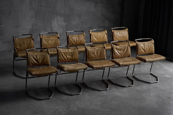 Image 1 of Eetkamerstoel van leer en staal, ontworpen door Raymond Rombouts, België, 20e eeuw.