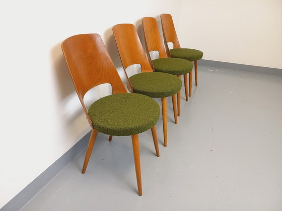 Image 1 of Set van 4 vintage Mondor stoelen van Baumann in hout en bouclé stof uit de jaren 60