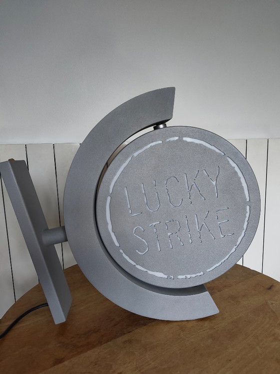 Image 1 of Vintage draaiend lichtreclamebord Lucky Strike