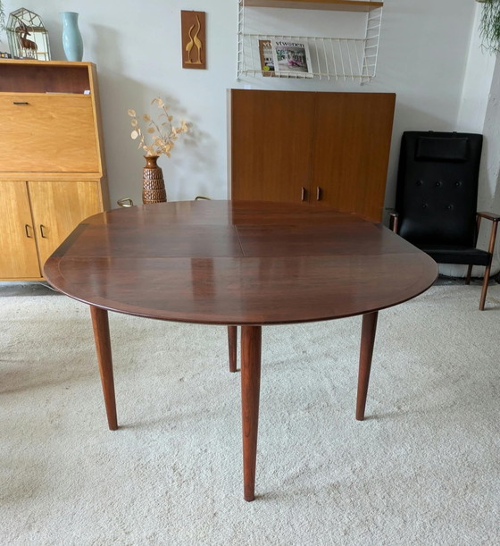 Vintage rosewood round extendable dining table (photo 6 of 11)