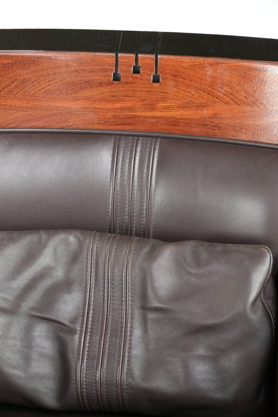 Image 1 of Luxe Schuitema Art Deco design set bestaande uit een fauteuil en hocker uit de Decoforma serie in chocolade bruin rundleer