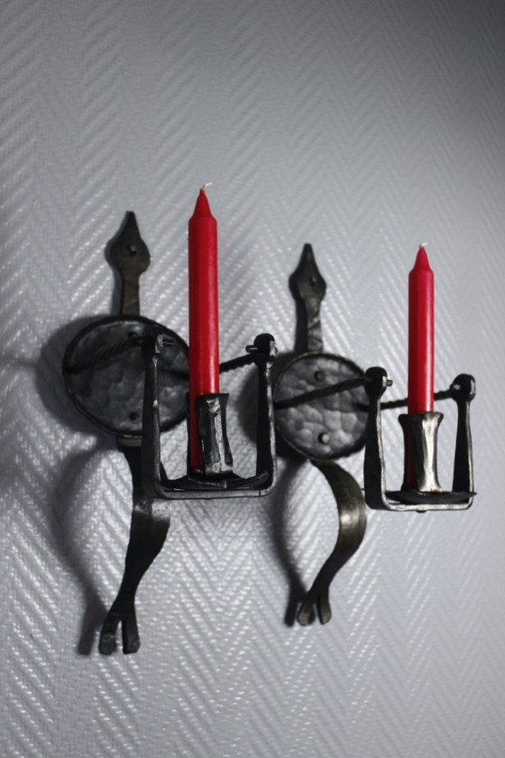 Image 1 of Pair of wrought iron castle-style wall sconces with candles, mid-20th century