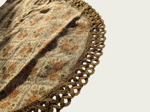 Vintage tablecloth/placecloth with floral pattern and gold-colored trim