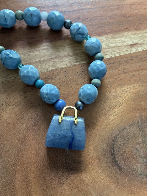 Image 1 of New necklace with blue vintage beads and a small agate bag as a pendant
