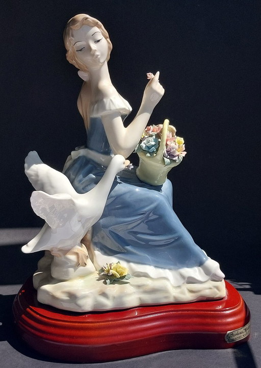 Large porcelain figurine: Lady with a goose and basket of flowers
