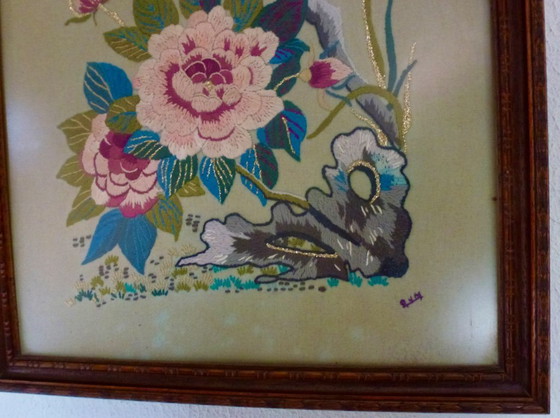 Image 1 of Vintage hand-embroidered wall tapestry, behind glass, with a crane, butterflies and flowers.