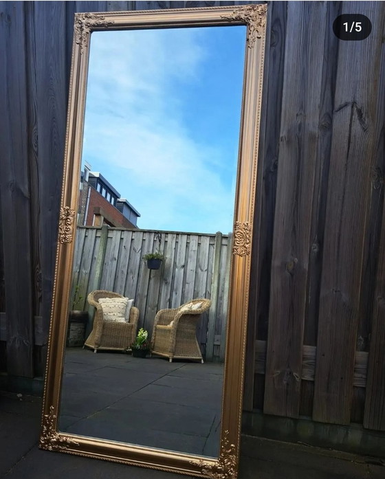 Image 1 of Unique large gold-bronze mirror with facet