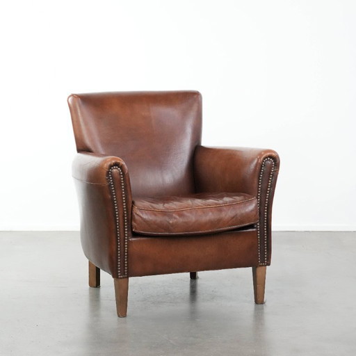 Fauteuil vintage en peau de mouton aux magnifiques couleurs chaudes