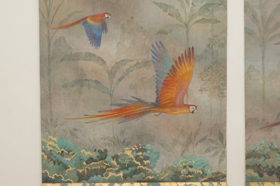 Image 1 of Contemporary painted canvas depicting parrots in a tropical forest.