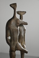 Tall sculpture on a marble pedestal