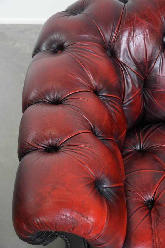 Image 1 of Rode rundleren chesterfield buttonseat fauteuil
