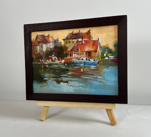 Origineel olieverfschilderij: Avondstadslandschap, zonsondergang met gloed over de daken.