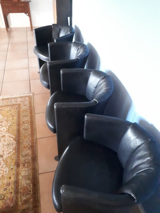 Four Rolf Benz armchairs in black leather