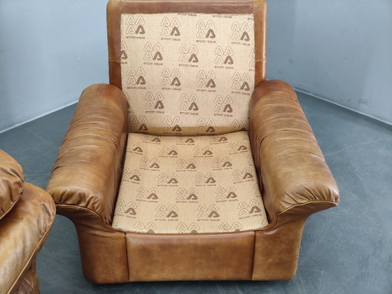 Image 1 of Een paar Arcon Italia loungefauteuils van cognacbruin buffelleer.
