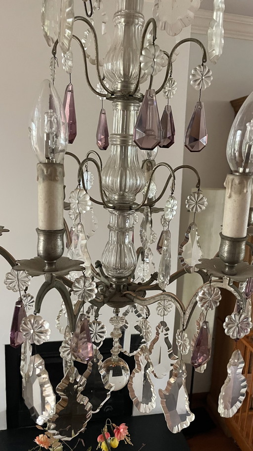 Elegant antique French chandelier with colored pendants