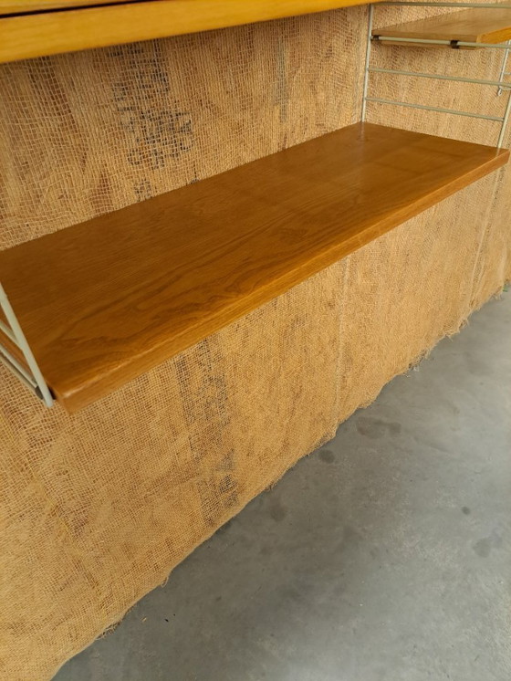 Image 1 of Sistema di parete modulare String con armadio e ripiani