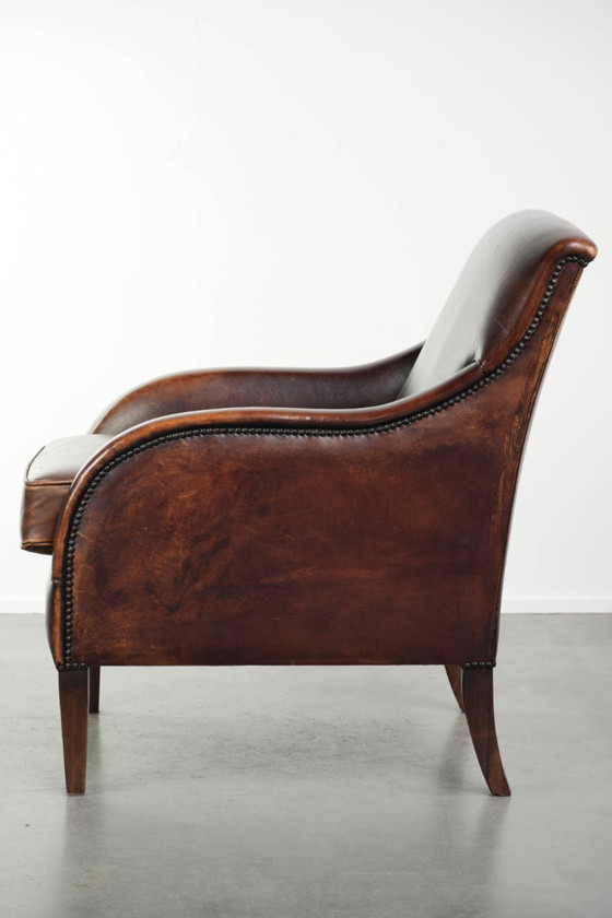 Image 1 of Poltrona di design in pelle di pecora in buone condizioni, con un bellissimo colore intenso e una seduta confortevole.