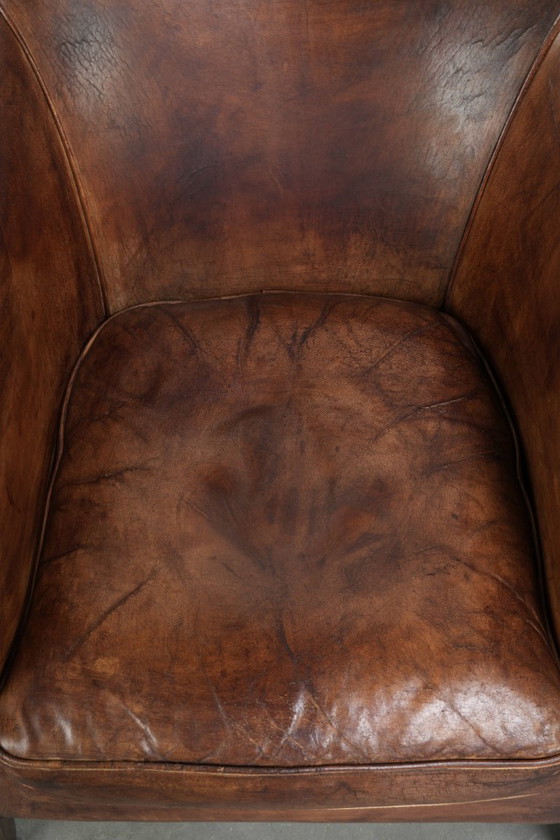 Image 1 of 2 fauteuils club vintage en peau de mouton, au look superbe et à l'assise confortable.