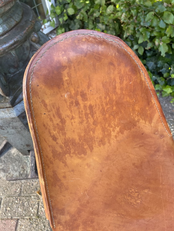 Image 1 of Jaren 60 vlinderstoel met tuiglederen zitting