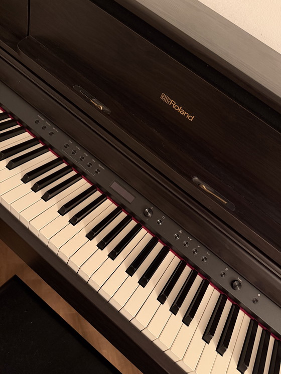 Image 1 of Uitstekende Roland XL705-DR piano - palissanderhout