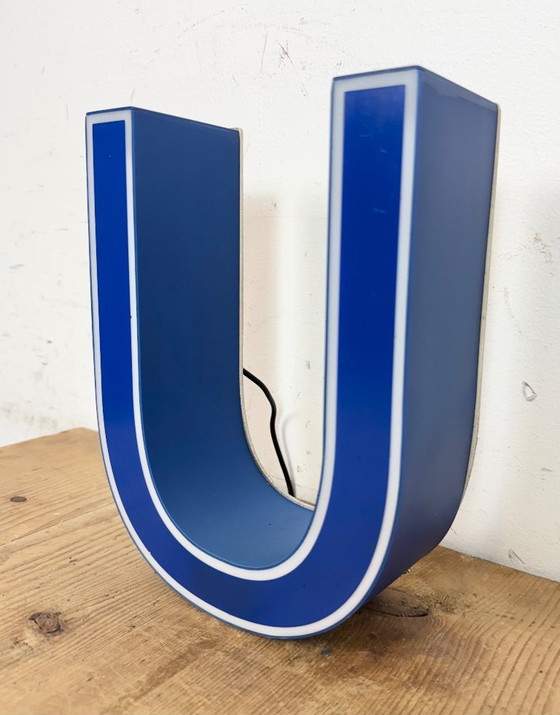 Image 1 of Industrial dark blue enamel factory pendant light made in United Kingdom during the 1950s. White enamel inside the shade. Brass 