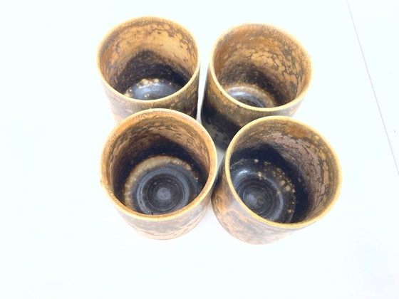 Image 1 of   1 jug and 4 mugs from the 50s 60s by Gotlind Weigel.  Ceramic.  Good used condition. Some chips to the rim