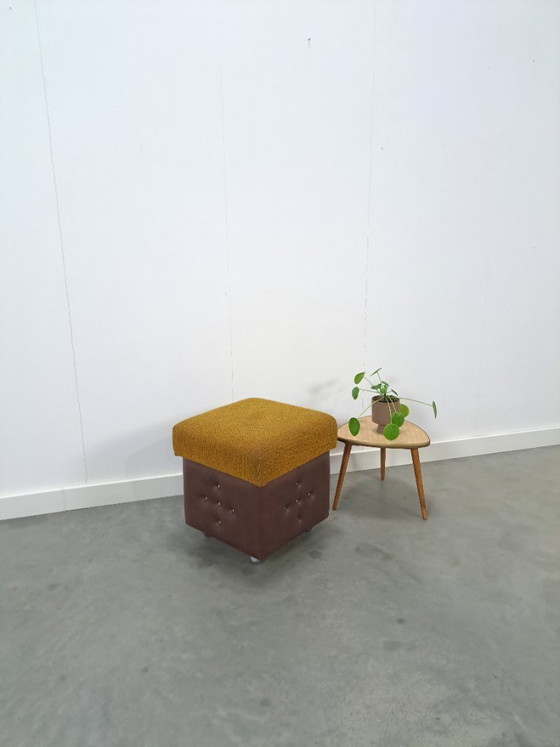 Image 1 of Ottoman with lid on chrome wheels