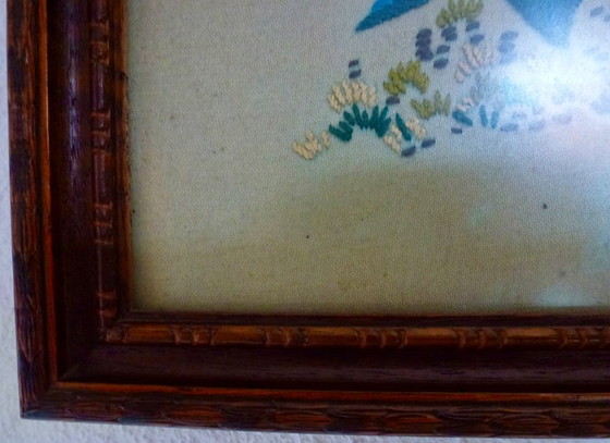 Image 1 of Vintage hand-embroidered wall tapestry, behind glass, with a crane, butterflies and flowers.