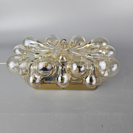 Image 1 of Vintage glass bubble wall lamp by Glashutte Limburg. Design by Helena Tynell. Glass and brass. 1960, Germany.