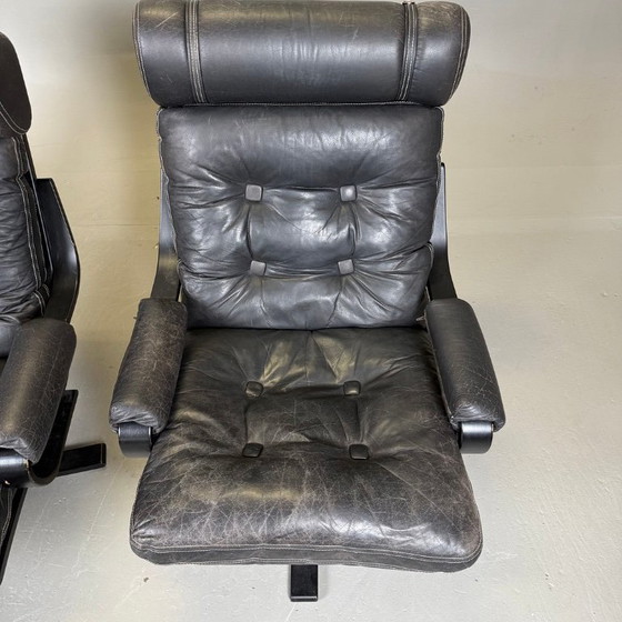 Image 1 of Pair of black leather, metal and wood Mid-Century Modern spinning armchairs in good condition with small signs of aging, 2 items