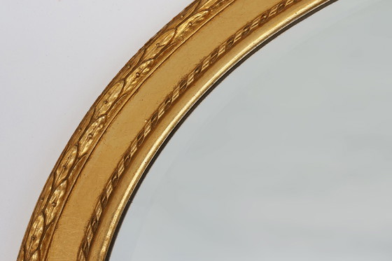 Image 1 of Oval shaped carved gilded Baroque mirror with beveled glass, Belgium  