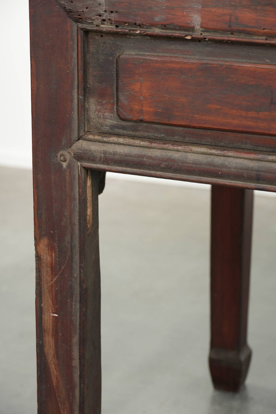 Image 1 of Antique wooden Chinese sideboard from the late 19th century in a beautiful red color with exquisite wood carving.