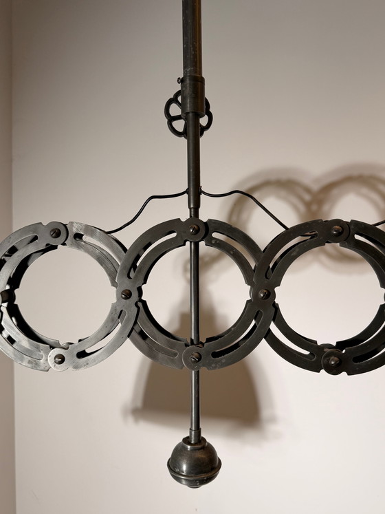 Suspension industrielle en forme de ciseaux (photo 5 of 8)