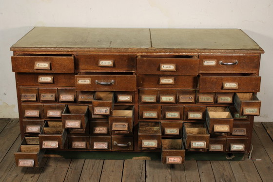 Image 1 of Antique industrial apothecary cabinet • Vintage wood and metal drawer cabinet with many compartments