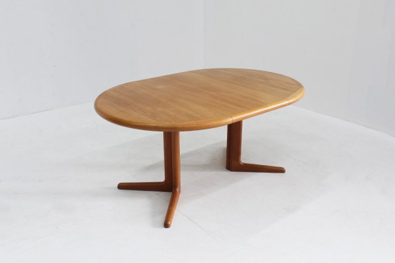 Image 1 of Vintage Danish round extendable teak dining table from the 1960s