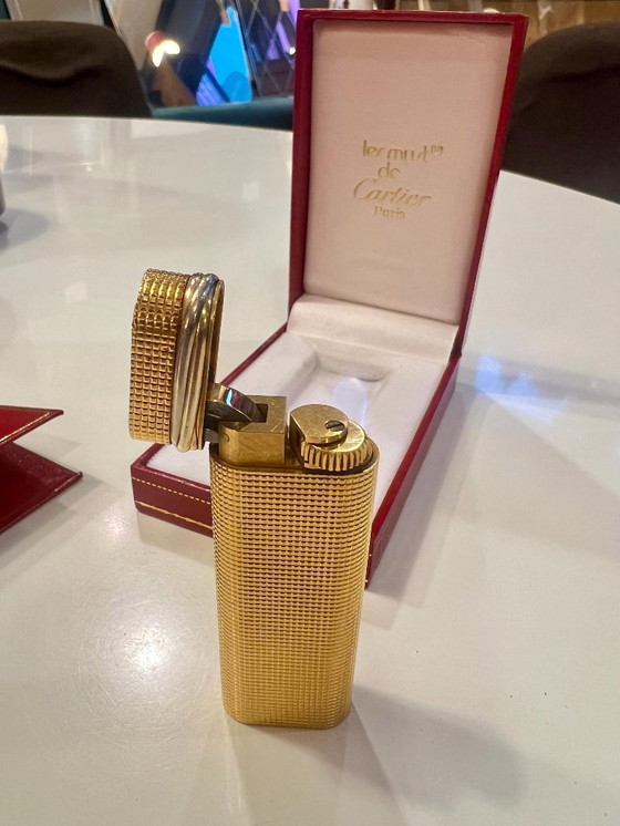 Image 1 of Original vintage Cartier Lighter gold-plated with Trinity ring made in 1983 with certificate, original box and case