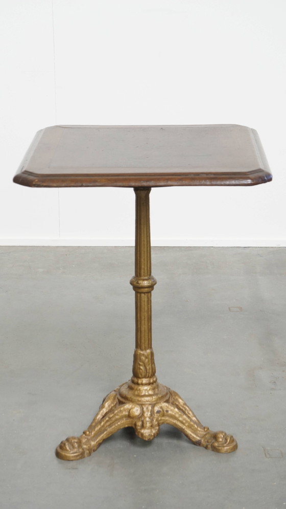 Image 1 of Table de bistrot française ancienne avec pied en fonte dorée et plateau en chêne foncé