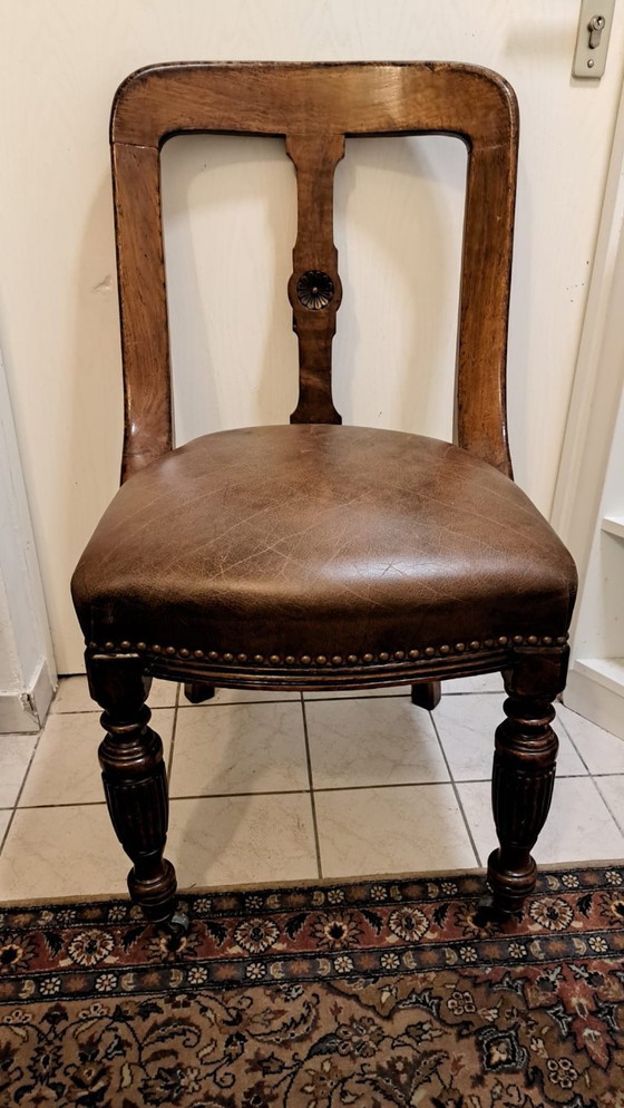 Image 1 of 4 antique wooden chairs with leather upholstery and decorative nails